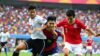 Pemain Indonesia vs Filipina bertanding di lapangan sepak bola.